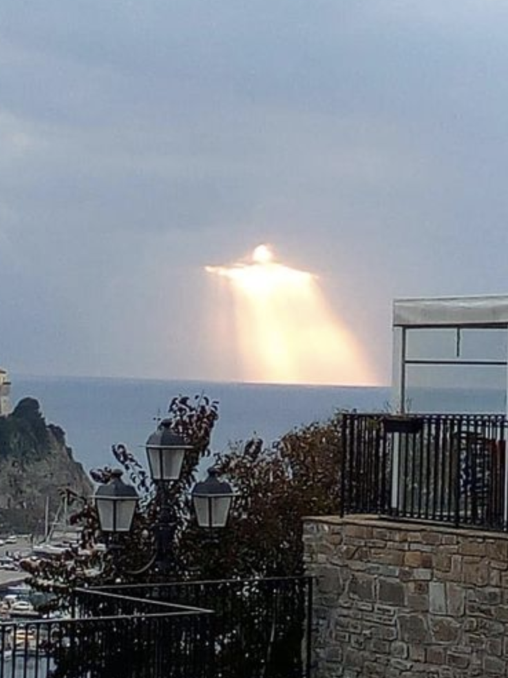 Capturing the Divine: Glowing Figure Resembles Christ the Redeemer Statue