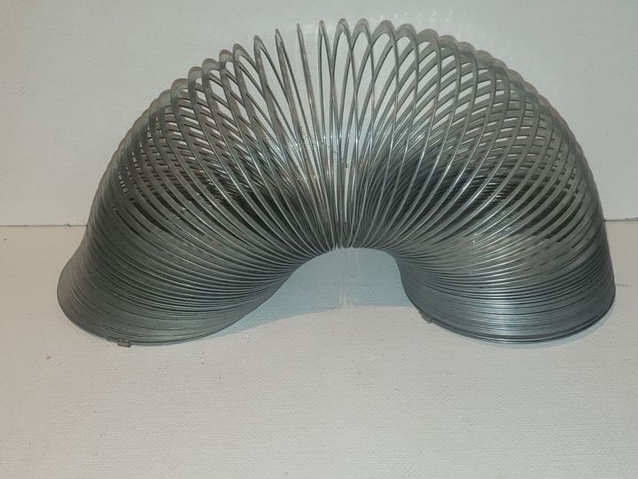 The Vintage SLINKY Original Walking Spring Toy: A Timeless Classic