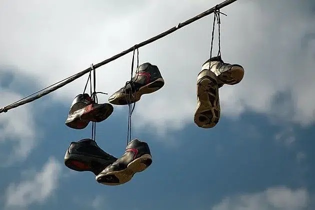 The Mystery Behind Sneakers Hanging from Power Lines