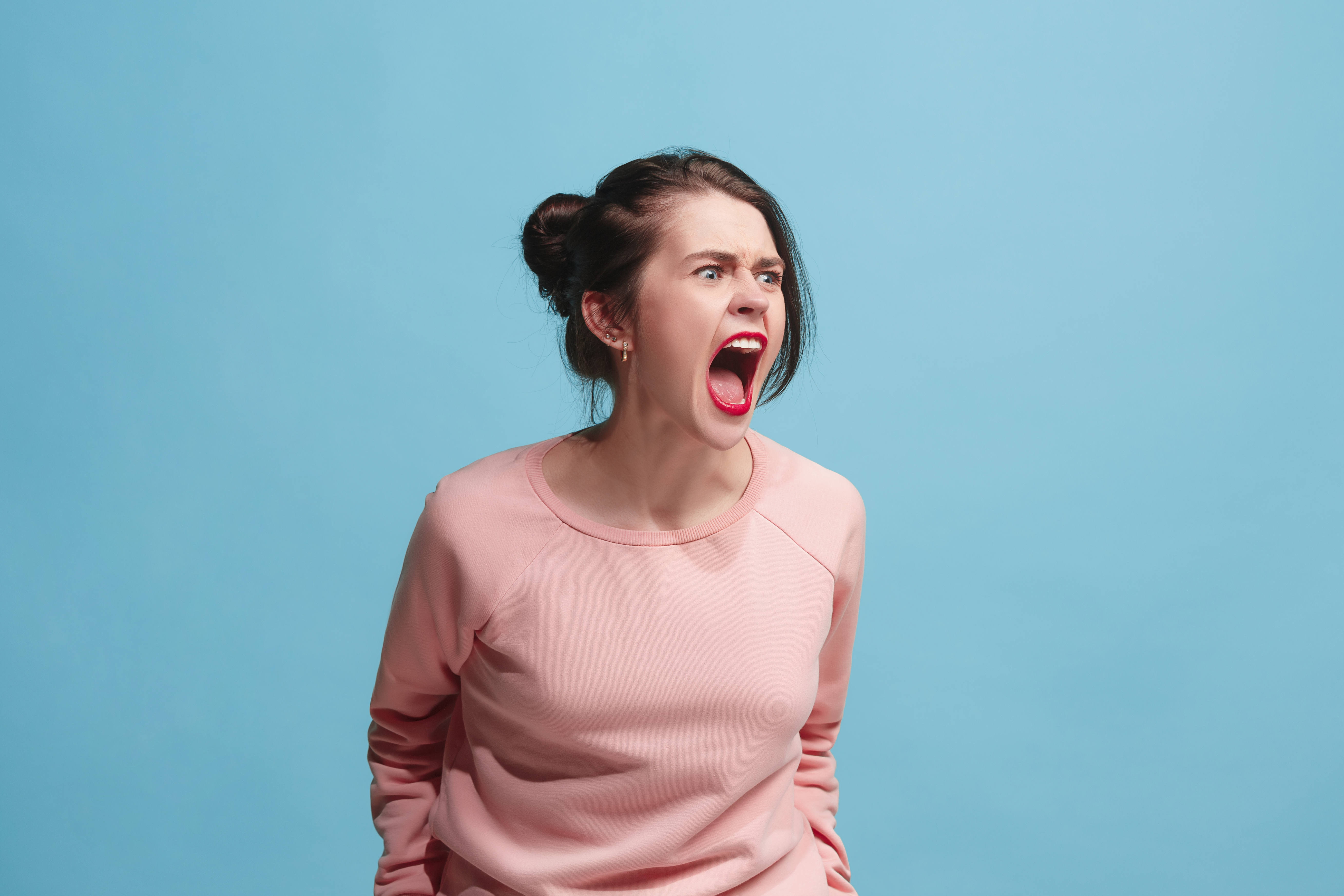 An angry woman shouting | Source: Getty Images